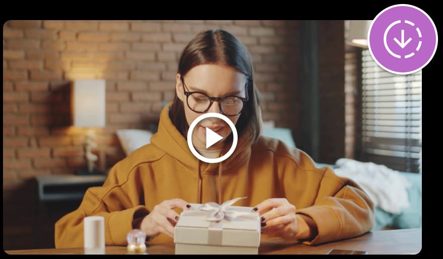 The video preview features a play button in the middle. It shows a woman looking at a gift box.